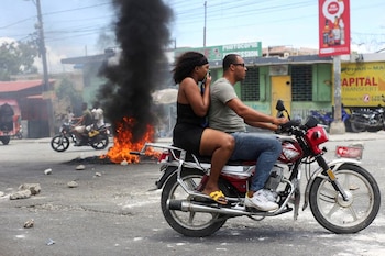 Image de fichier: un motocycliste